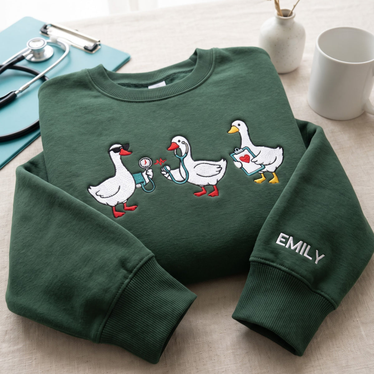 Personalized Nurse Geese Trio Stethoscope Blood Pressure Clipboard embroidered sweatshirt — front view