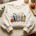 Personalized Halloween Teacher Crayon Book Pencil Pumpkin Ghost embroidered sweatshirt — front view