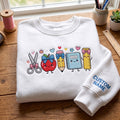 Personalized Teacher School Supplies Kawaii Scissor Apple Pencil Notebook Ruler embroidered sweatshirt — front view