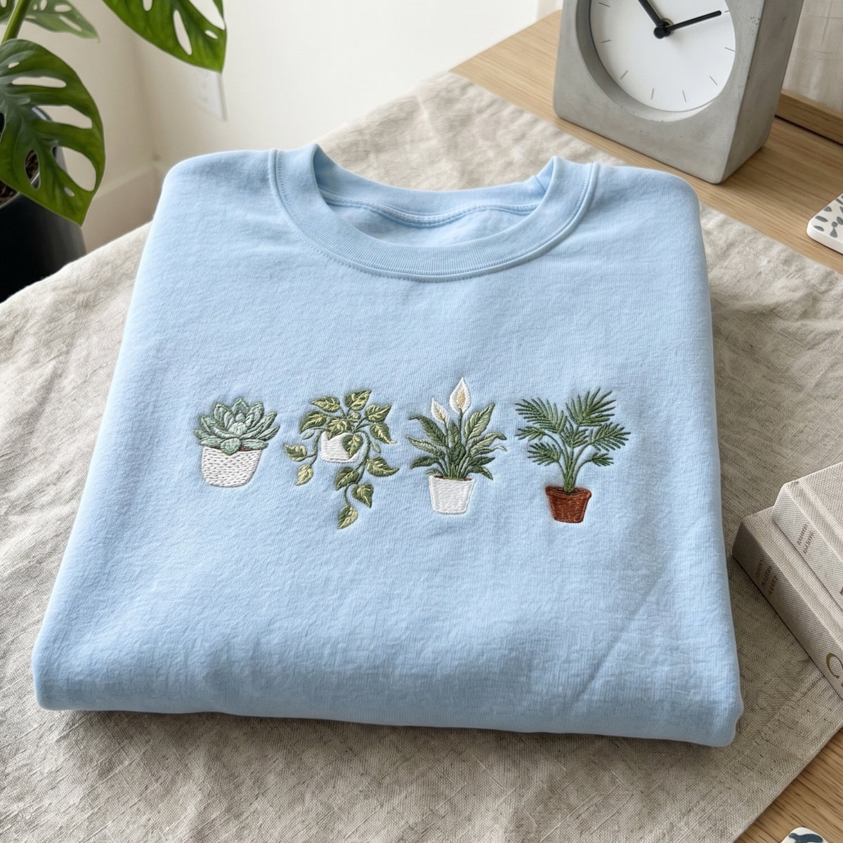 Four Potted Houseplants Succulent Pothos Peace Lily Areca Palm embroidered sweatshirt — front view