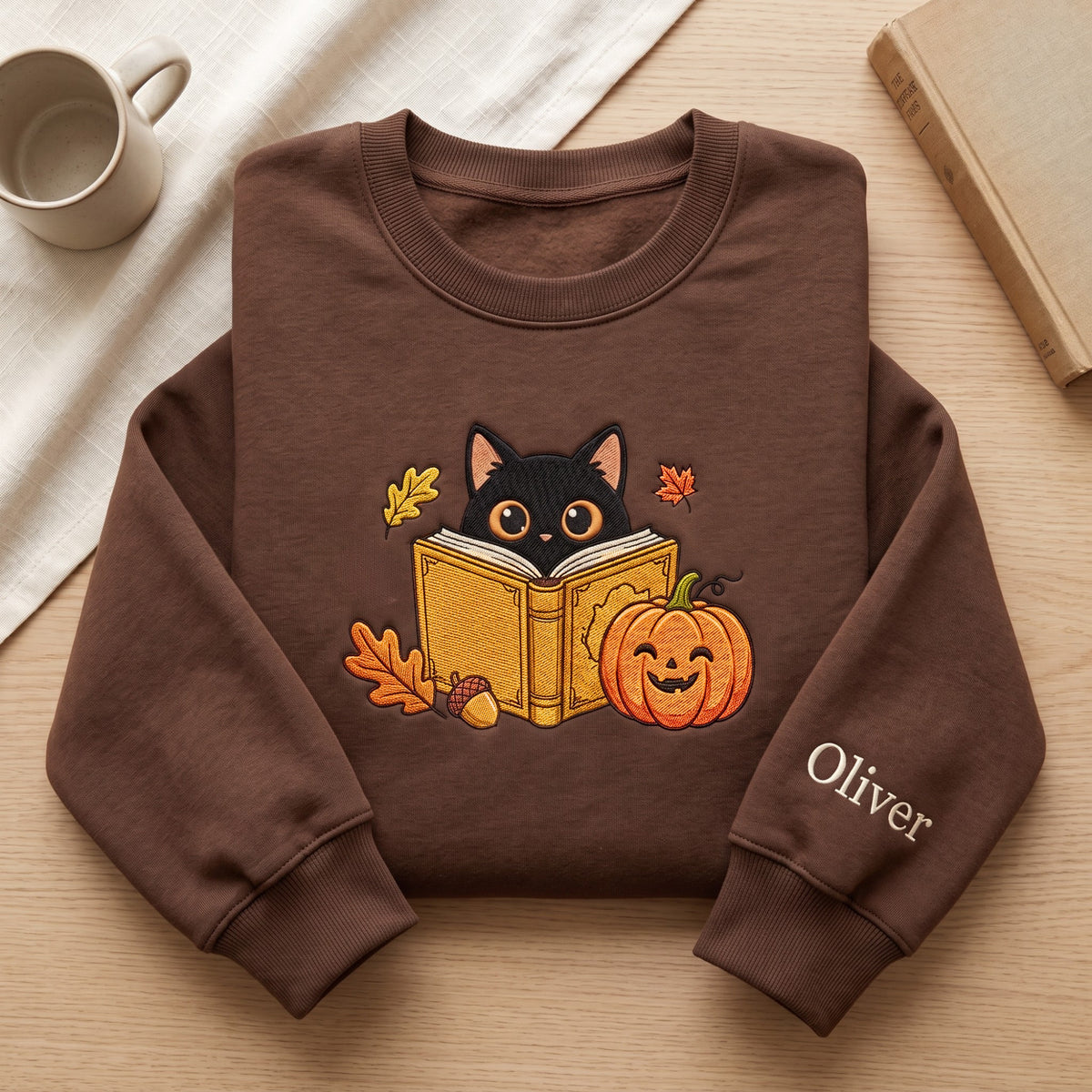 Personalized Fall Black Cat Reading Book Pumpkin Halloween embroidered sweatshirt — front view
