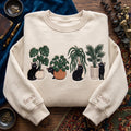 Personalized Black Cats Houseplants Monstera Palm embroidered sweatshirt — front view
