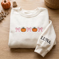 Personalized Halloween Pumpkin Coquette Bows Name on Sleeve embroidered sweatshirt — front view