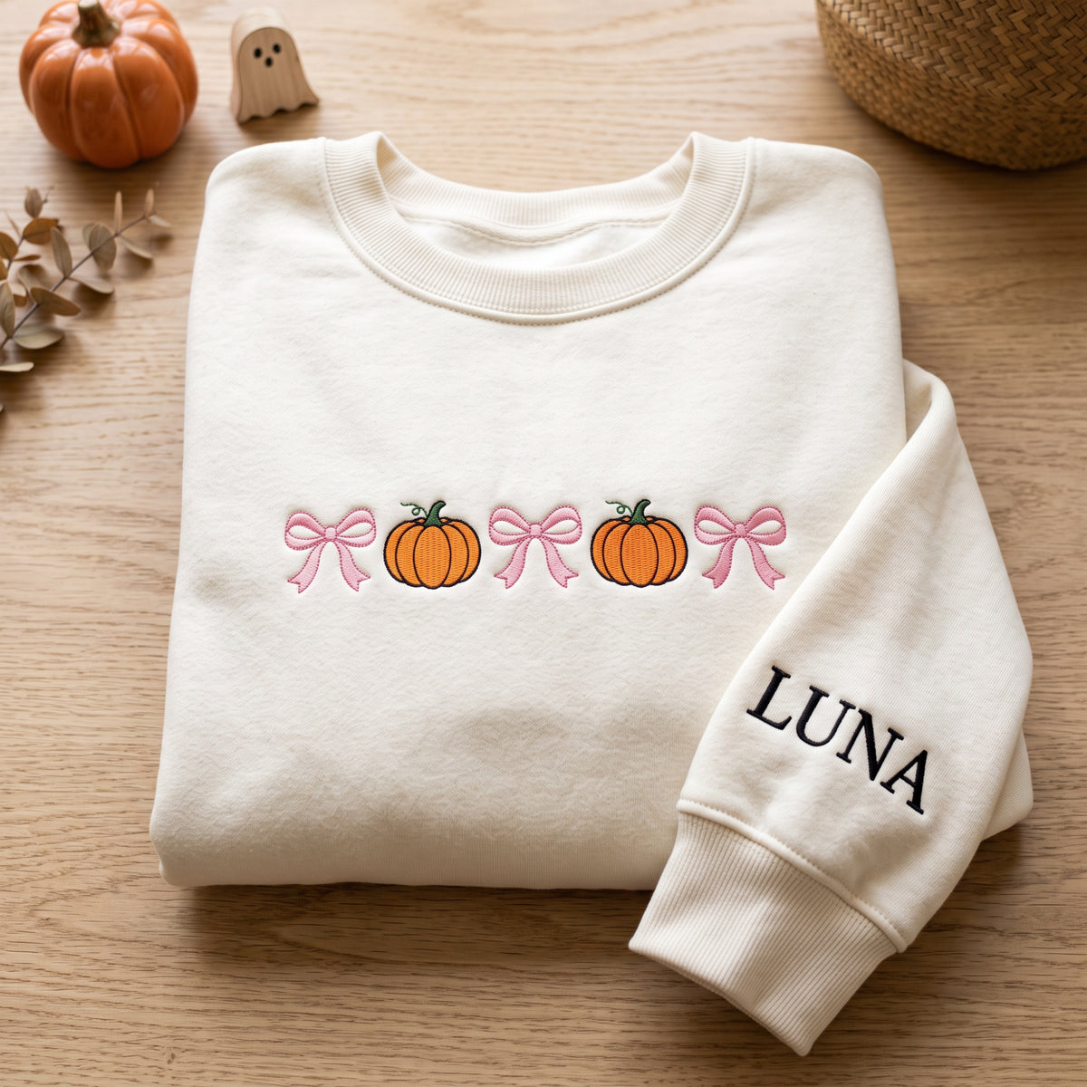 Personalized Halloween Pumpkin Coquette Bows Name on Sleeve embroidered sweatshirt — front view