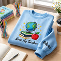 Personalized Love My Teacher Globe Books Apple Stars embroidered sweatshirt — front view