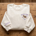 Personalized Beagle Mom Paw Prints Left Chest Name on Sleeve embroidered sweatshirt — front view