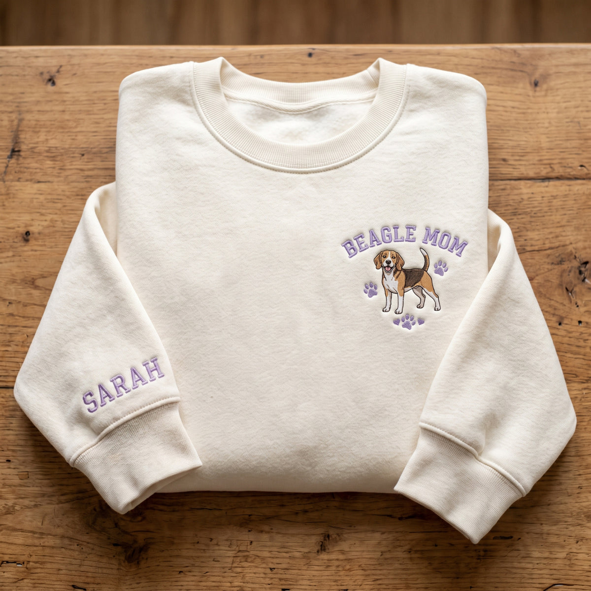 Personalized Beagle Mom Paw Prints Left Chest Name on Sleeve embroidered sweatshirt — front view