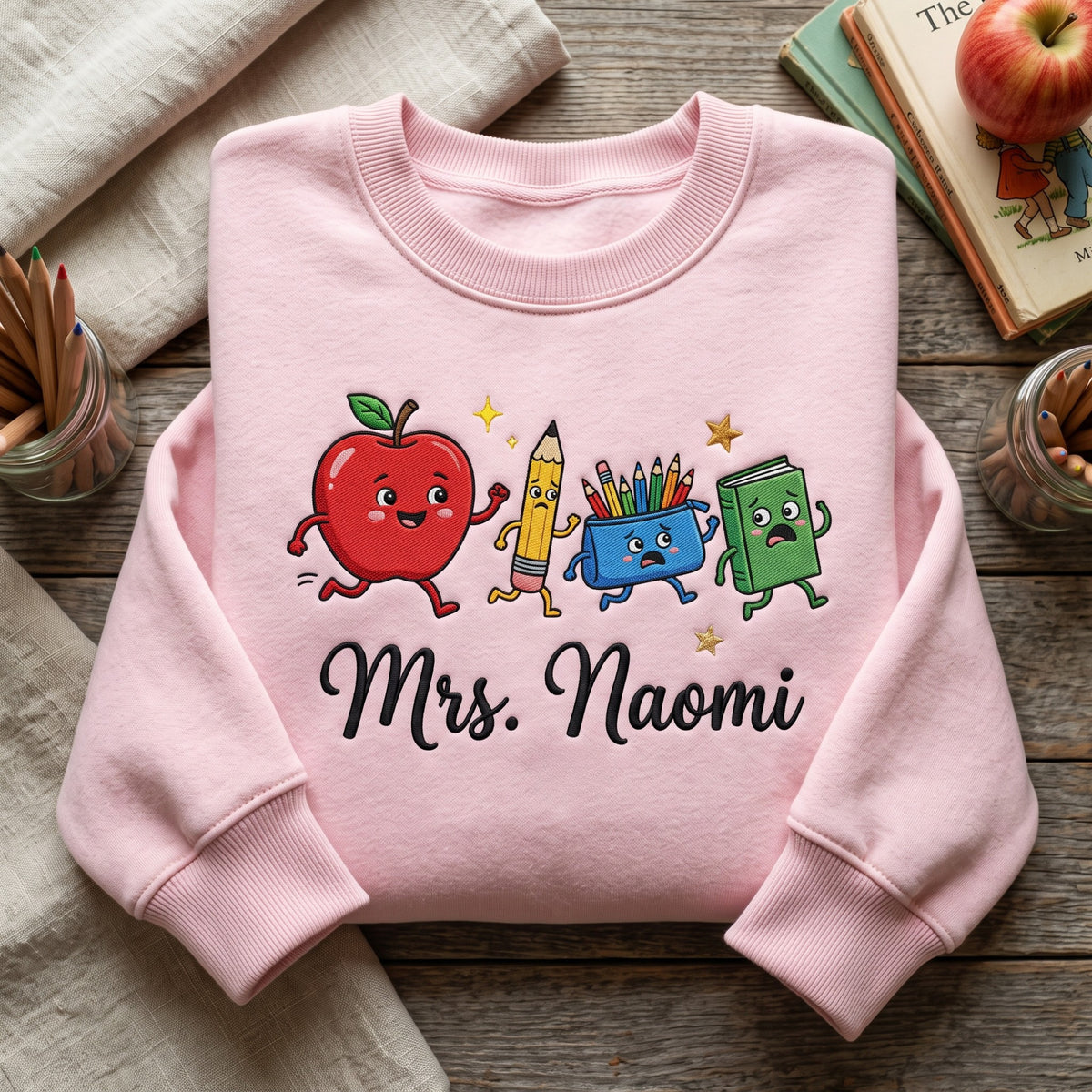Personalized Teacher Running Apple Pencil Crayon Cup Book Kawaii embroidered sweatshirt — front view
