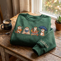 Personalized Cute Otters Coffee Book Autumn Leaves Rain Umbrella embroidered sweatshirt — front view