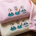 Nurse Goose Trio RN Scrubs Stethoscope Syringe Rx Clipboard embroidered sweatshirt — front view
