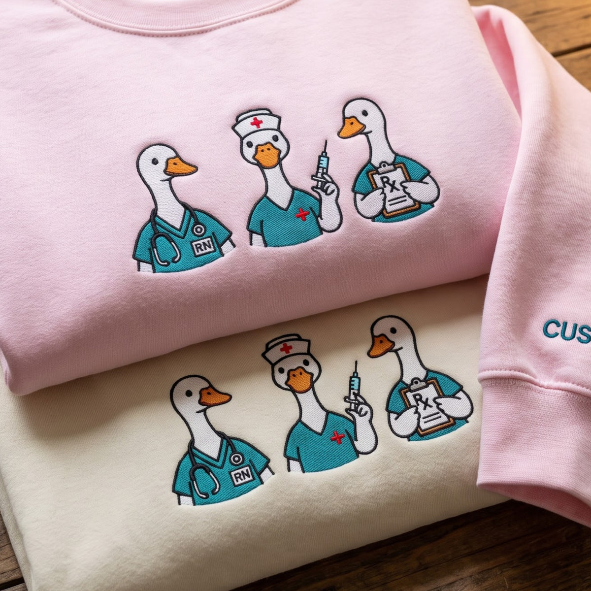 Nurse Goose Trio RN Scrubs Stethoscope Syringe Rx Clipboard embroidered sweatshirt — front view