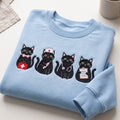 Nurse Black Cats Medical Kit Stethoscope Clipboard embroidered sweatshirt — front view