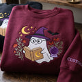 Halloween Ghost Witch Hat Reading Book Crystal Ball Wildflowers Bat Moon embroidered sweatshirt — front view