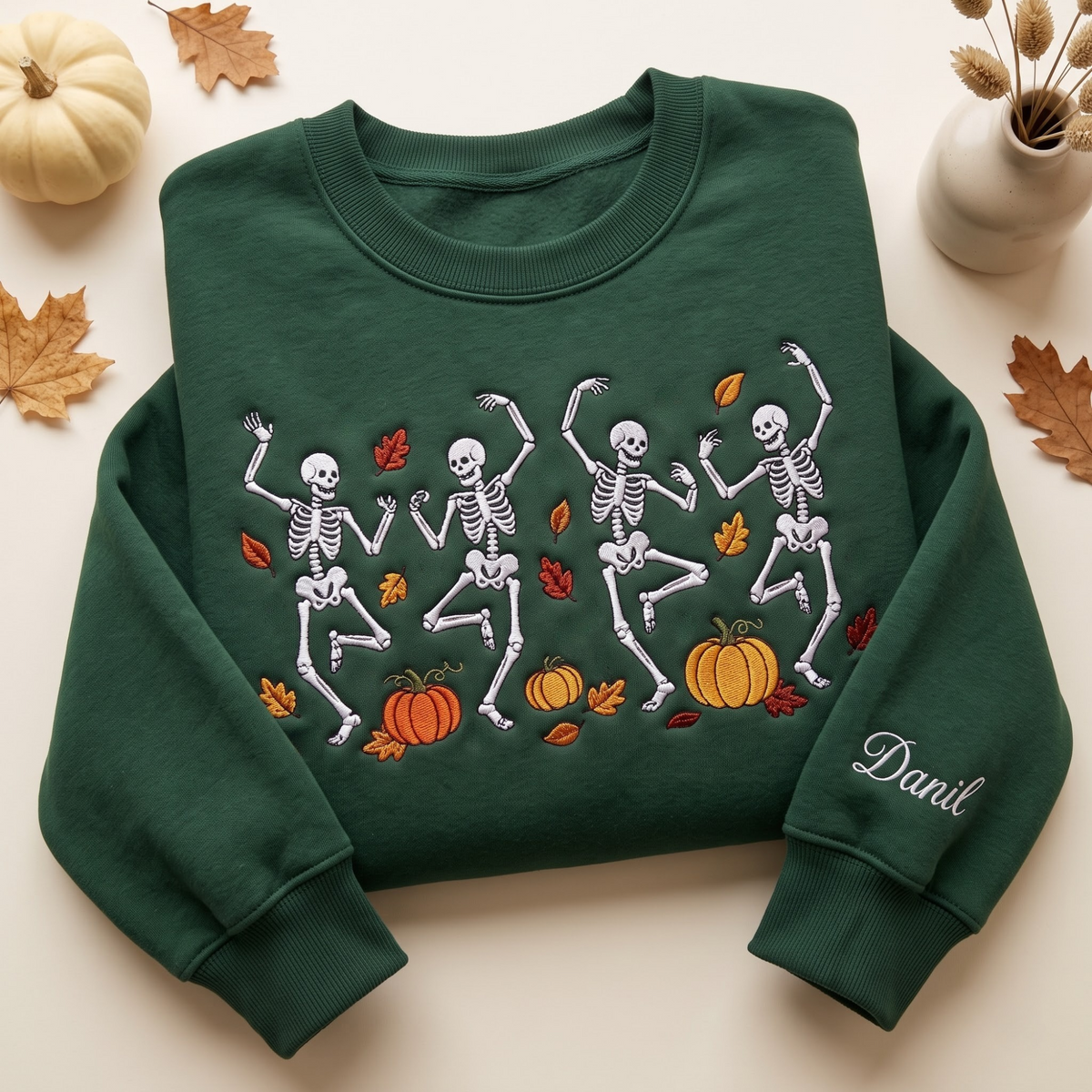Personalized Halloween Dancing Skeletons Fall Pumpkins Autumn Leaves Name on Sleeve embroidered sweatshirt — front view