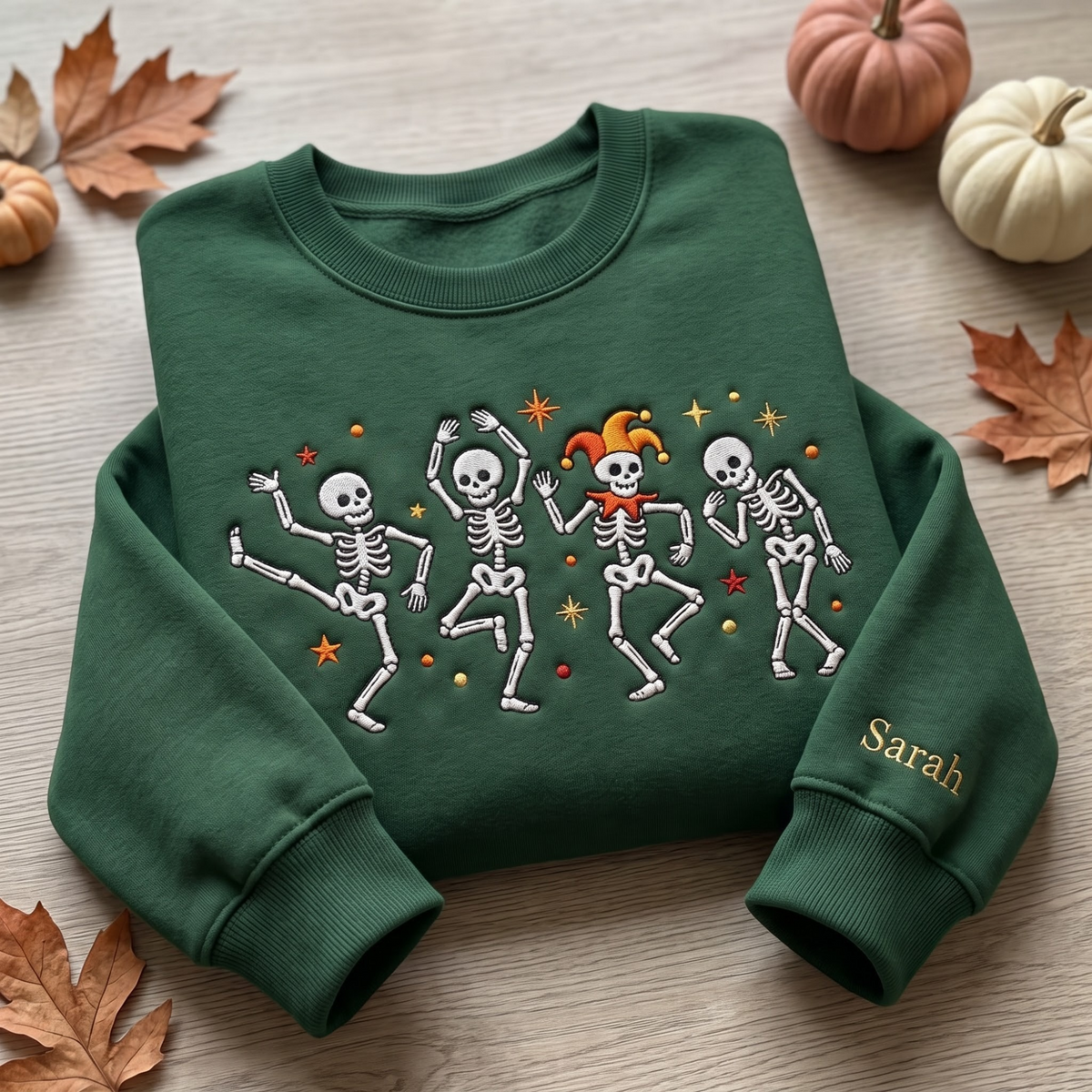 Personalized Halloween Dancing Skeletons Jester Hat Stars Name on Sleeve embroidered sweatshirt — front view
