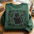 Black Cat Reading Book Floral Wreath embroidered sweatshirt — front view