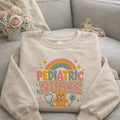 Pediatric Nurse Rainbow Teddy Bear Stethoscope Colorful embroidered sweatshirt — front view