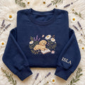 Personalized Golden Retriever Reading Book Wildflower Garden Sleeve Name embroidered sweatshirt — front view