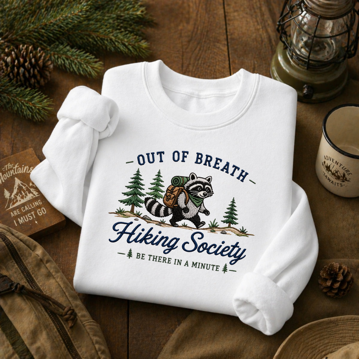 Out of Breath Hiking Society Raccoon Hiker Forest embroidered sweatshirt — front view