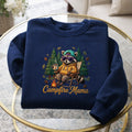 Campfire Mama Raccoon Camping Chair Coffee Mug Pine Trees embroidered sweatshirt — front view
