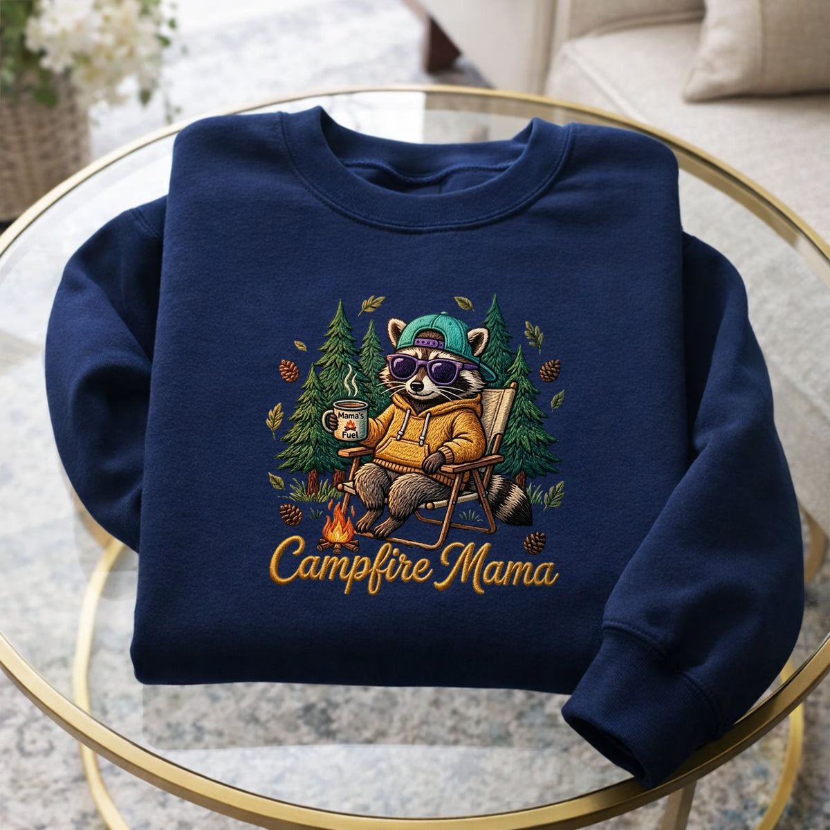 Campfire Mama Raccoon Camping Chair Coffee Mug Pine Trees embroidered sweatshirt — front view