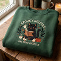 Spooky Readers One More Chapter Black Cat Ghost Pumpkin Halloween embroidered sweatshirt — front view