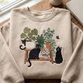 Black Cats Indoor Plants Bench Botanical Garden embroidered sweatshirt — front view