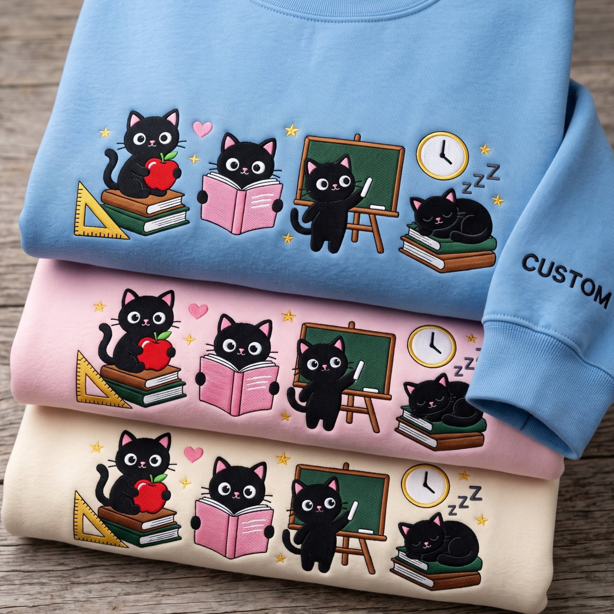Personalized Black Cat Teacher Life Apple Chalkboard Books embroidered sweatshirt — front view