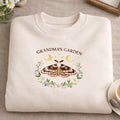 Grandma's Garden Moth Floral Wreath Moon Stars embroidered sweatshirt — front view
