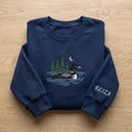 Personalized Common Loon Lake Pine Trees Crescent Moon embroidered sweatshirt — front view