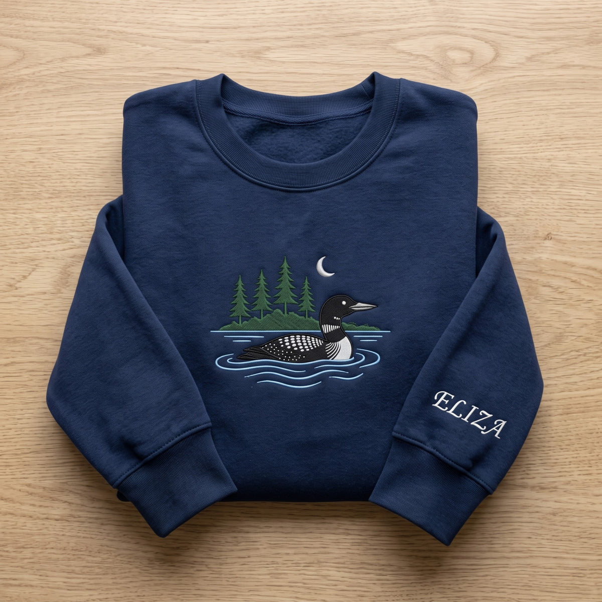 Personalized Common Loon Lake Pine Trees Crescent Moon embroidered sweatshirt — front view