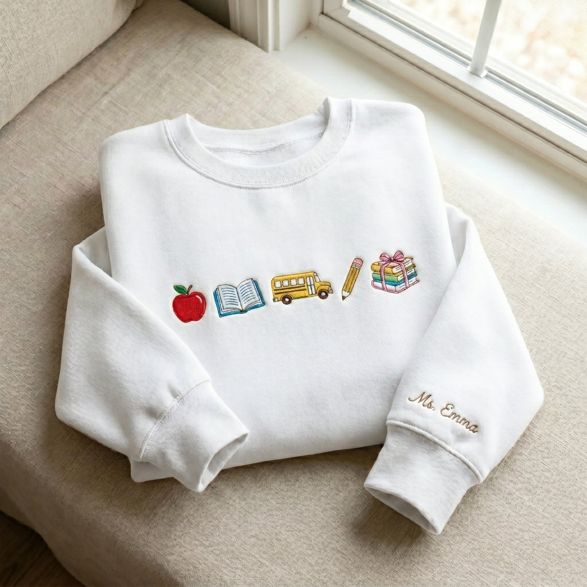 Personalized Teacher Name Apple Book School Bus Pencil Stacked Books embroidered sweatshirt — front view