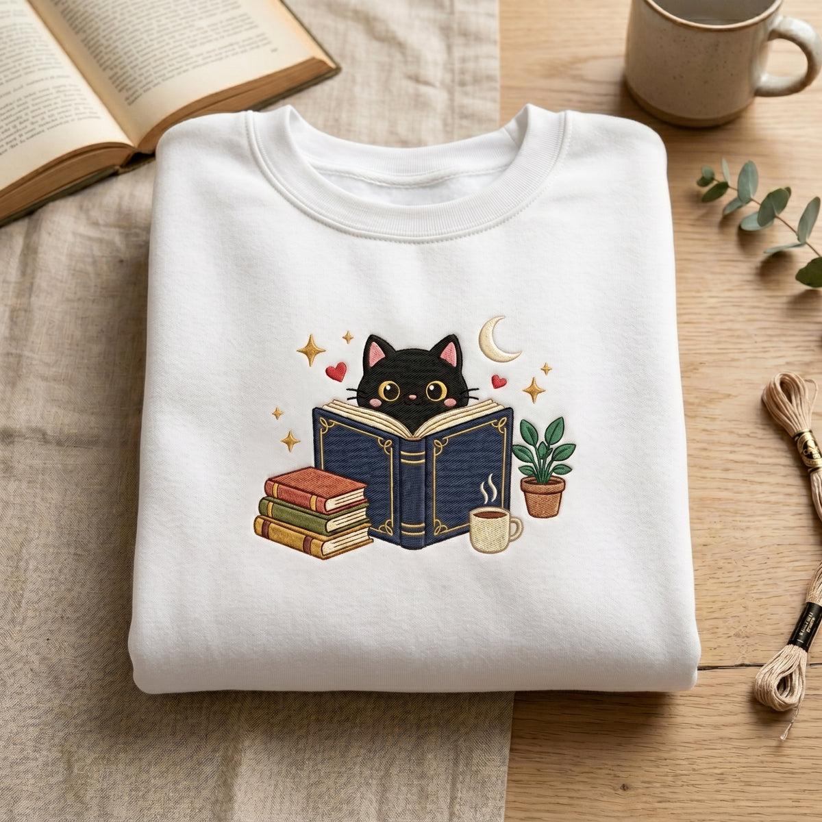 Black Cat Reading Book Coffee Plant Moon Stars embroidered sweatshirt — front view