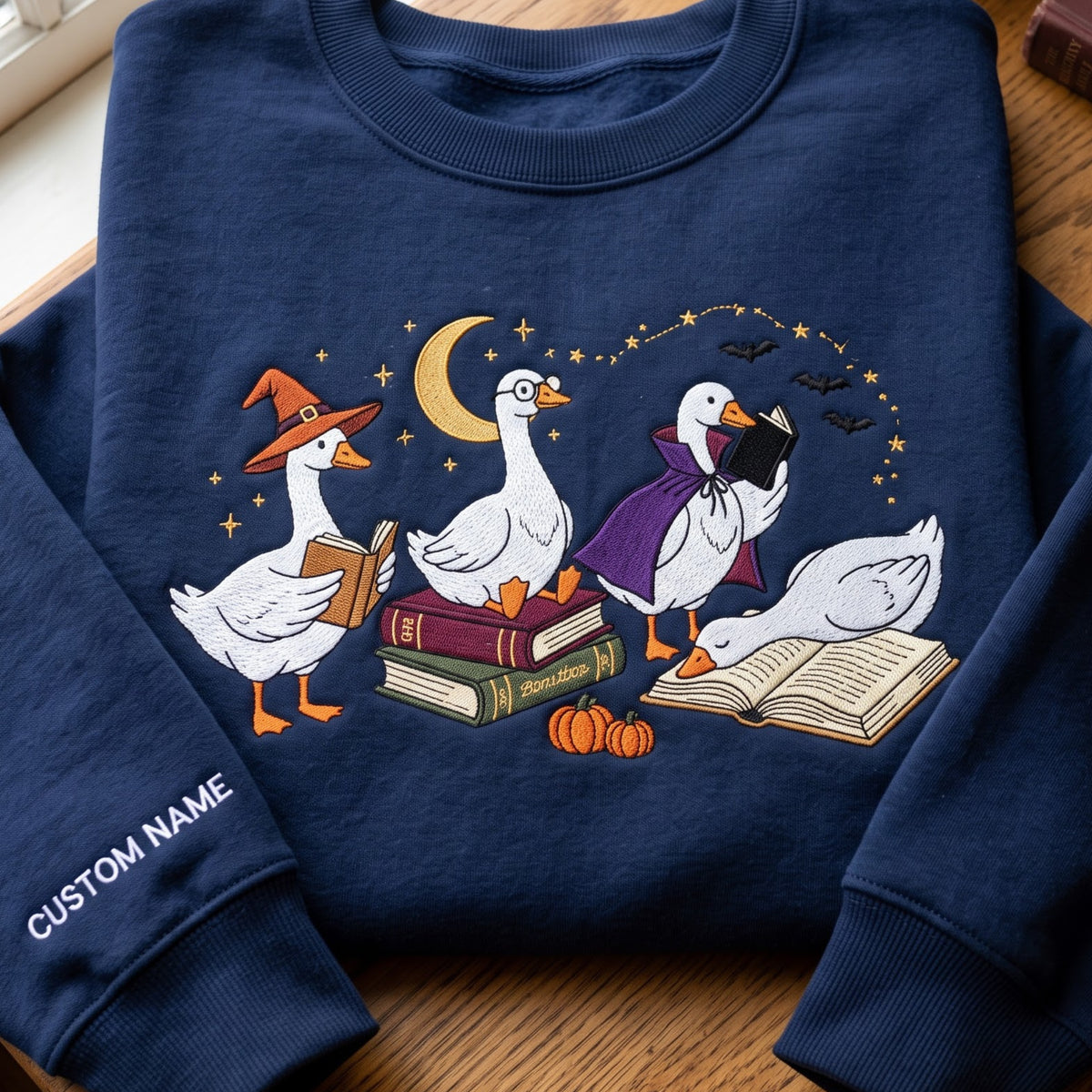 Personalized Halloween Reading Geese Witch Vampire Cape Books Pumpkin Moon Bats embroidered sweatshirt — front view
