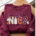Personalized NICU Nurse Halloween Ghost Pumpkin Bat Witch Hat Stethoscope embroidered sweatshirt — front view