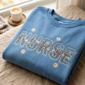 Nurse Wildflower Floral Letters Botanical Daisy Rose embroidered sweatshirt — front view