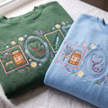 Nurse Floral Stethoscope Pill Bottle Bandage Syringe Cottagecore embroidered sweatshirt — front view