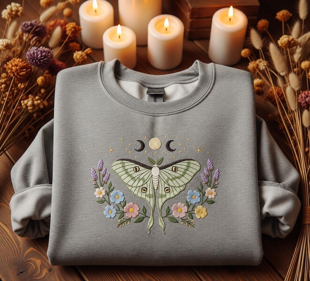 Luna Moth Moon Phase Triple Moon Wildflower Celestial Botanical embroidered sweatshirt — front view
