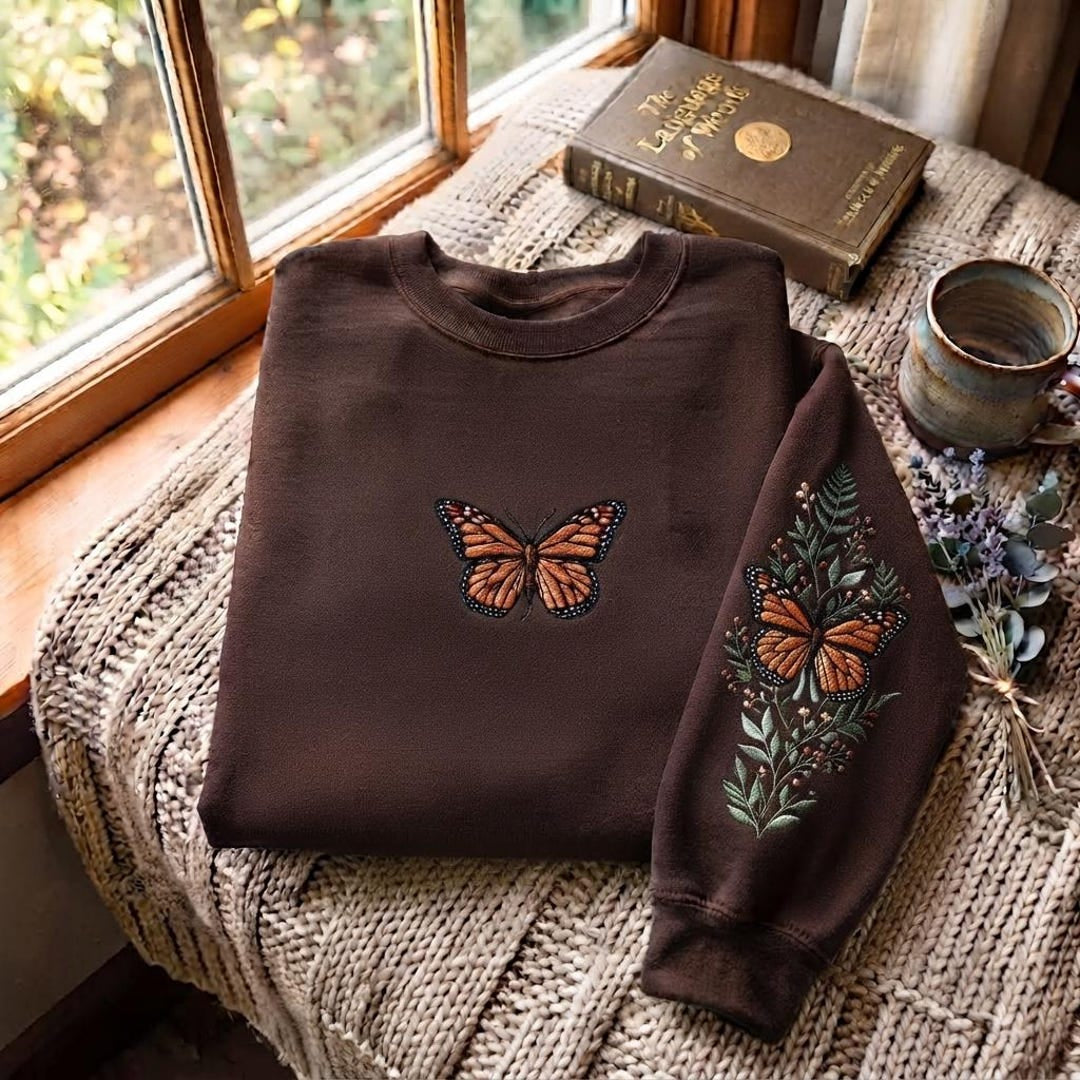 Monarch Butterfly Botanical Wildflower Sleeve embroidered sweatshirt — front view