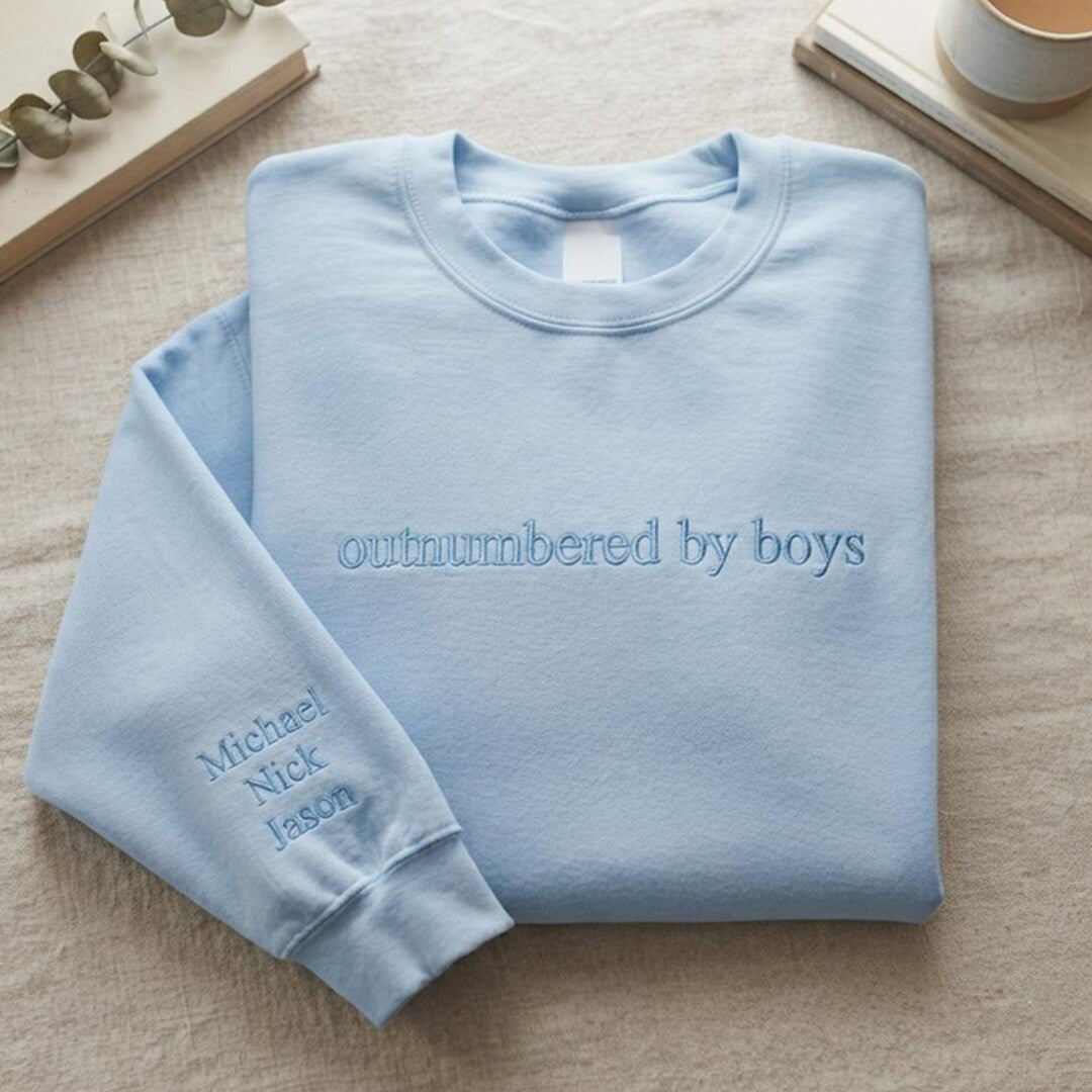Personalized Outnumbered by Boys Mom Names on Sleeve Tone on Tone embroidered sweatshirt — front view