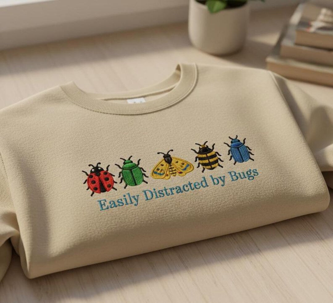 Easily Distracted by Bugs Five Colorful Insects Ladybug Bee Beetle Moth embroidered sweatshirt — front view