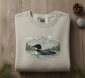 Common Loon Mountain Lake Forest Scene Nature Wildlife embroidered sweatshirt — front view