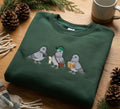 Three Tourist Pigeons Camera Book Map Bird Lover embroidered sweatshirt — front view