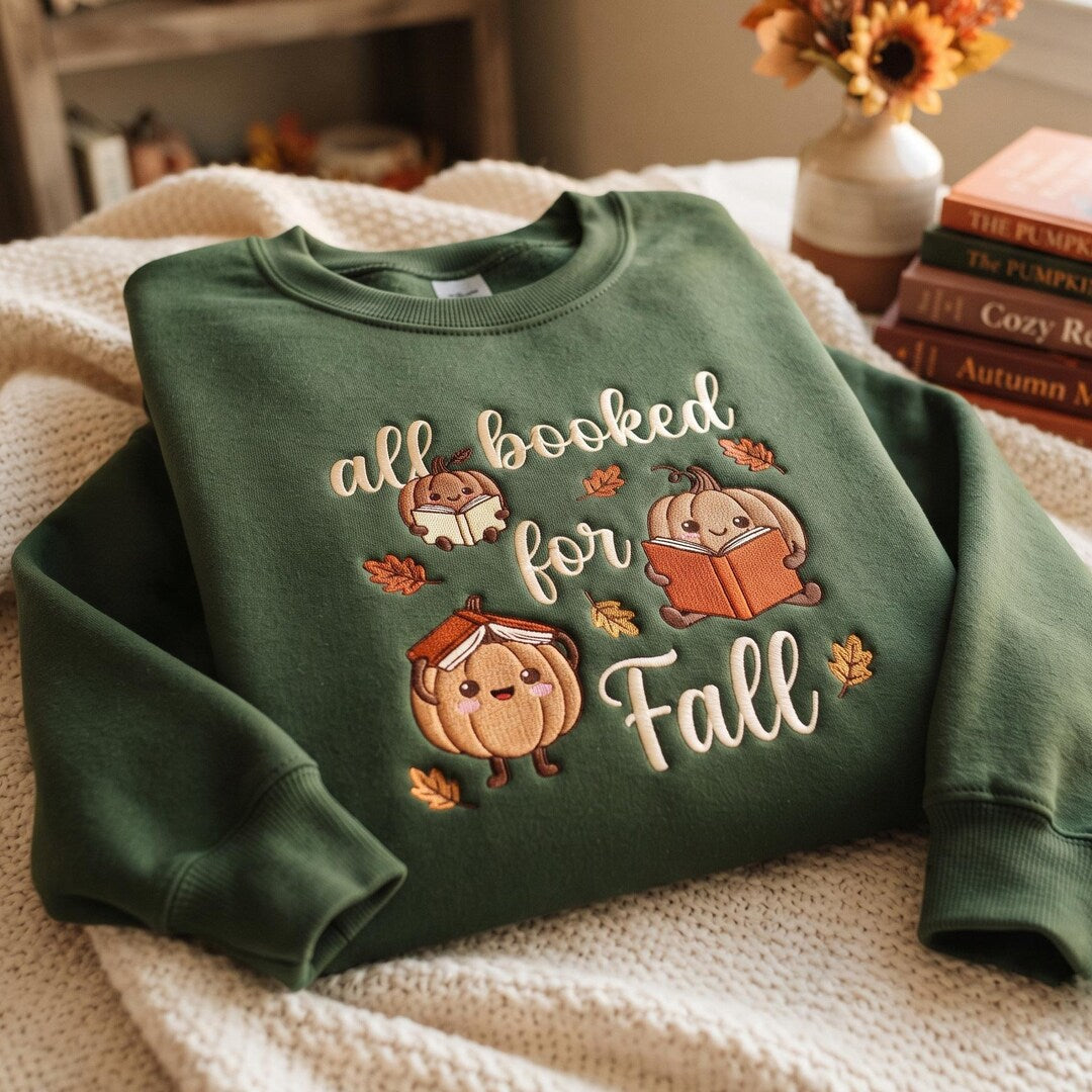 All Booked for Fall Kawaii Pumpkins Reading Books Autumn Leaves embroidered sweatshirt — front view