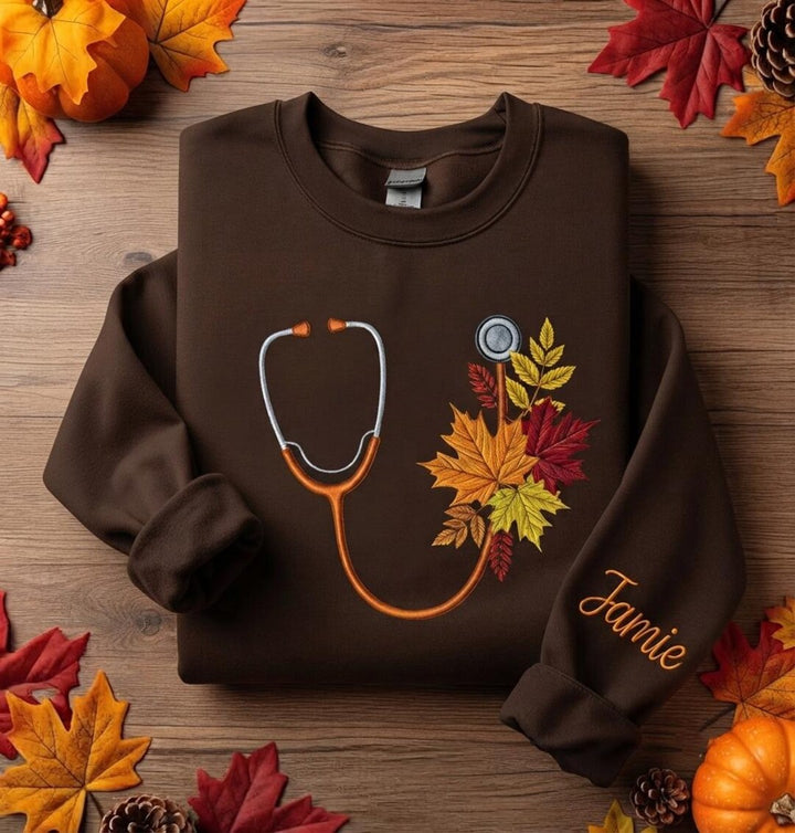 Personalized Fall Nurse Stethoscope Autumn Leaves Custom Name Sleeve embroidered sweatshirt — front view