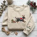 Personalized Rottweiler Christmas Reindeer Antlers Lights Sled Dog Name Sleeve embroidered sweatshirt — front view