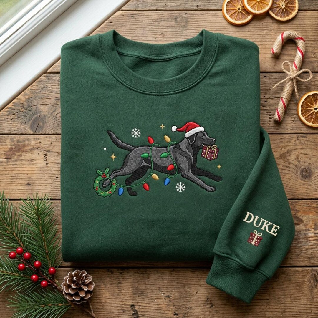 Personalized Black Labrador Christmas Lights Santa Hat Running Dog Pet Name embroidered sweatshirt — front view