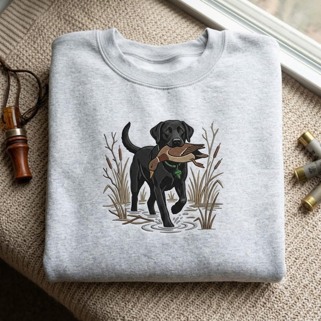 Black Lab Duck Hunting Retriever Cattails Marsh Wildlife embroidered sweatshirt — front view