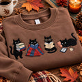 Four Black Cats Reading Books Blanket Kindle Coffee Cozy Reader embroidered sweatshirt — front view