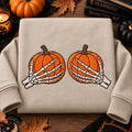 Halloween Skeleton Hands Grabbing Pumpkins Spooky embroidered sweatshirt — front view